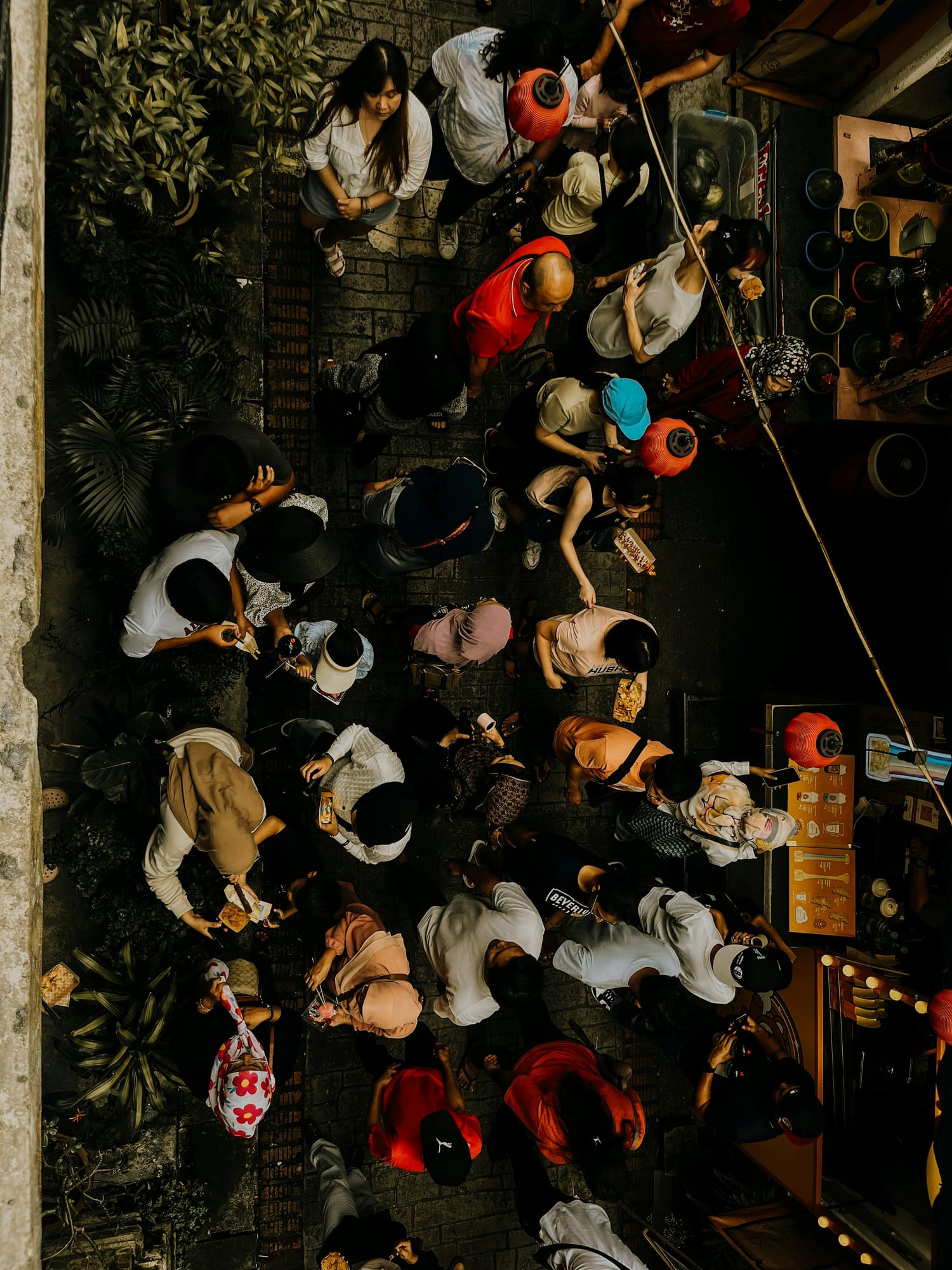 A crowded market at night, seen from above